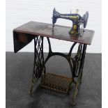 Singer sewing machine on treadle base, 97 x 100cm