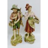 Royal Dux pair of early 20th century bisque figures, both modelled standing with bare feet, the