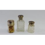 A group of three Birmingham silver topped glass bottles, two with internal stoppers, tallest 12cm