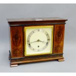 Mahogany cased mantle clock, the silvered chapter ring with Roman numerals on bracket feet, 33 x