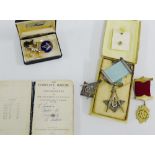 A collection of silver and gilt metal Masonic regalia to include badges, pendants, cufflinks, etc