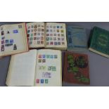 Six stamp albums containing a Penny Black and a Penny Red and other world stamps