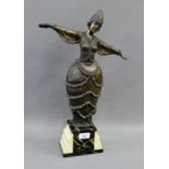 Contemporary Art Deco style resin figure on a faux hardstone base, 48cm high