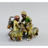 Early 20th century cold painted bronze figure group, 5cm wide