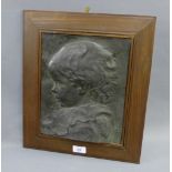 Bronze patinated metal rectangular wall plaque depicting a head and shoulders profile of a young