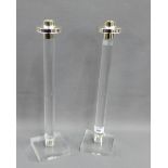 Pair of perspex column candlesticks on square plinth bases, 41cm high, (2)