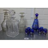 Blue glass and silver lustre liqueur set, together with three various glass decanters and