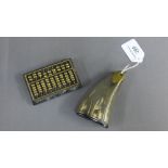 Brass mounted horn powder flask, 11cm long, together with a brass and hardstone miniature abacus, (