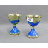 Margery Clinton, a pair of blue glazed lustre goblets, signed and dated 28.11.80, 13cm (2)