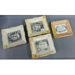 Group of four Sunderland lustre wall plaques with amber coloured borders to include 'God is Love'