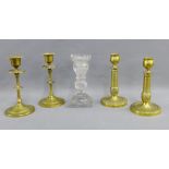 Collection of brass candlesticks together with a moulded glass candlestick, (5)