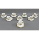 Royal Copenhagen porcelain demi tasse cups and saucers with floral sprays and gilt edged rims