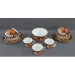 Derby 'Imari' pattern porcelain teaset comprising eleven cups, twelve saucers, twelve side plates
