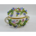 Meissen floral encrusted porcelain jar and cover with gilt edged rims and entwined handles, 12cm