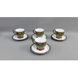 A set of four Denby cups and saucers (4)