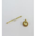 9 carat gold gemset pendant together with an unmarked gold and diamond bar brooch (2)