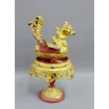 Giltwood box and cover in the form of a mythical bird, together with a circular pedestal stand, (2)