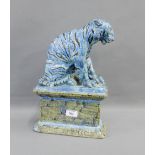 Blue glazed pottery Tiger on a rectangular plinth, 37cm high