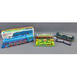 Group of vintage tin plate trains to include International Express tin plate locomotive, friction