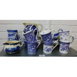 Collection of Staffordshire blue and white jugs and mugs etc., (a lot)