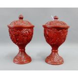 Pair of Chinese cinnabar urn vases and covers, 21cm high, (2)