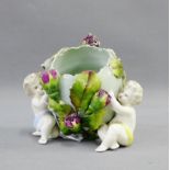 Continental porcelain cherub posy, 11cm high