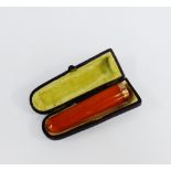 9 carat gold mounted amber cheroot, in fitted case 7cm long