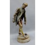 Patinated Spelter figure of a boules player on a circular plinth base, 52cm high