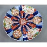Imari charger with scalloped edged rim, typically painted with birds, flowers, foliage etc. 40cm