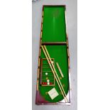 Mahogany cased Bagatelle board with cues and Bonzoline balls etc.