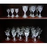 Quantity of drinking glasses to include wine and sherry all with facet stemmed bowls, (29)