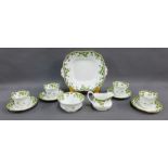 Aynsley porcelain teaset with green ivy and flower pattern with gilt edge rims, comprising six cups,