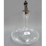 Contemporary clear glass decanter with a silver plated stopper with bronze figural finial which