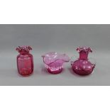 Three pieces of cranberry glass to include two vases and a bowl, (3)