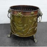 Brass and copper embossed pail with lion mask handles and on paw feet, 42 x 55cm