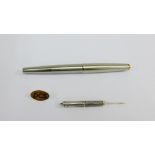 9 carat gold lapel pin, Birmingham silver toothpick by Cohen & Charles and a Parker pen with 14k nib