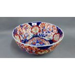 Chinese Imari bowl of circular lobed form typically painted with flowers, butterflies and foliage,