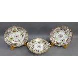 English porcelain dessert service with gilt edged rims and hand painted floral sprays, comprising