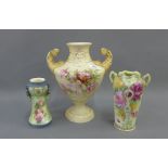 Royal Dux blush ivory twin handled pedestal vase together with two continental porcelain floral