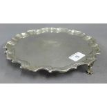 George V silver salver by Josiah Williams & Co, of circular form on three hoof feet, London 1917,