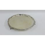 George V silver salver with reeded border rim, on three outswept feet, makers mark for Brook &