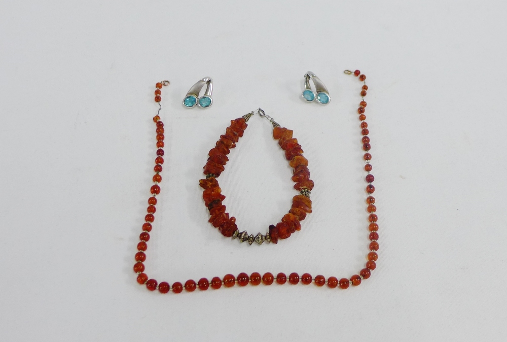 Pair of silver earrings, amber beads and an amber and white metal bracelet (3)