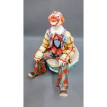 Italian art pottery figure of a Clown with a Milan paper label verso, 27cm high