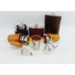A collection of Epns and leather hip flasks, a collapsible cup and a set of Epns graduated