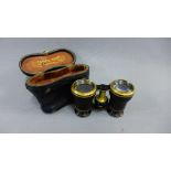 Pair of A & L leather and gilt metal opera glasses in original leather case