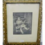 Black and white framed photographic print of a Young Girl, in a glazed and ornate giltwood frame,