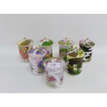 Set of seven Japanese porcelain floral patterned jars with covers, 11cm high, (7)