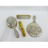 A collection of silver backed dressing tables brushes and hand mirror with mixed dates and makers (