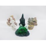 Group of two soapstone carvings, a Blanc de Chine Guan Yin figure, a green coloured resin Buddha