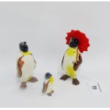 Three Beswick Penguins, one with a red umbrella, tallest 11cm, (3)